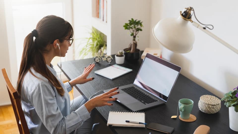 woman working from home on a desk