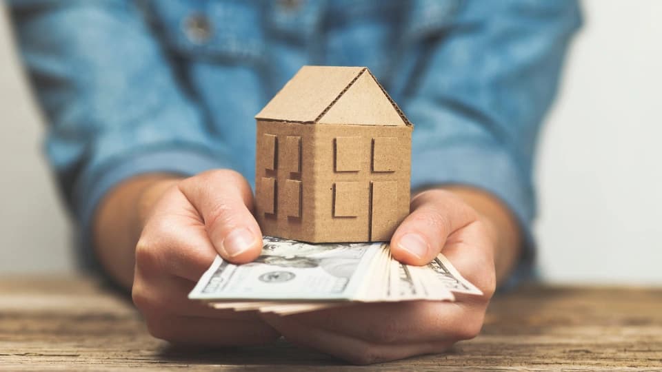 Money and a house in hand.