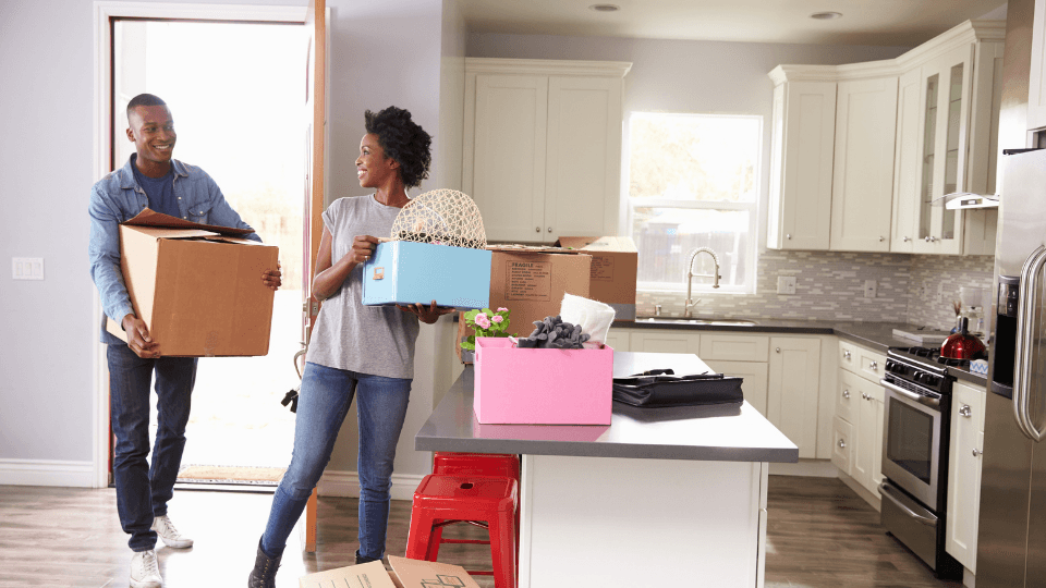 A couple with moving boxes