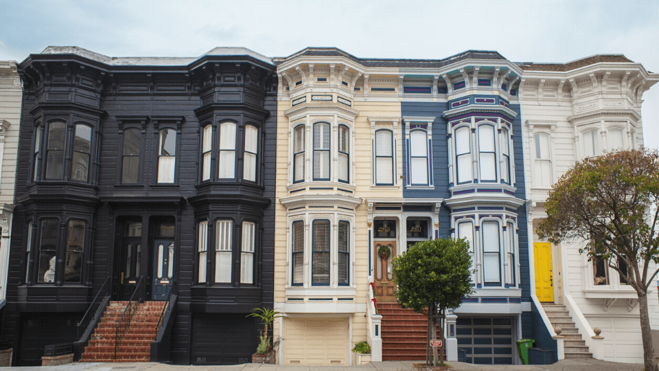 Street view of multi-colored apartment complexes
