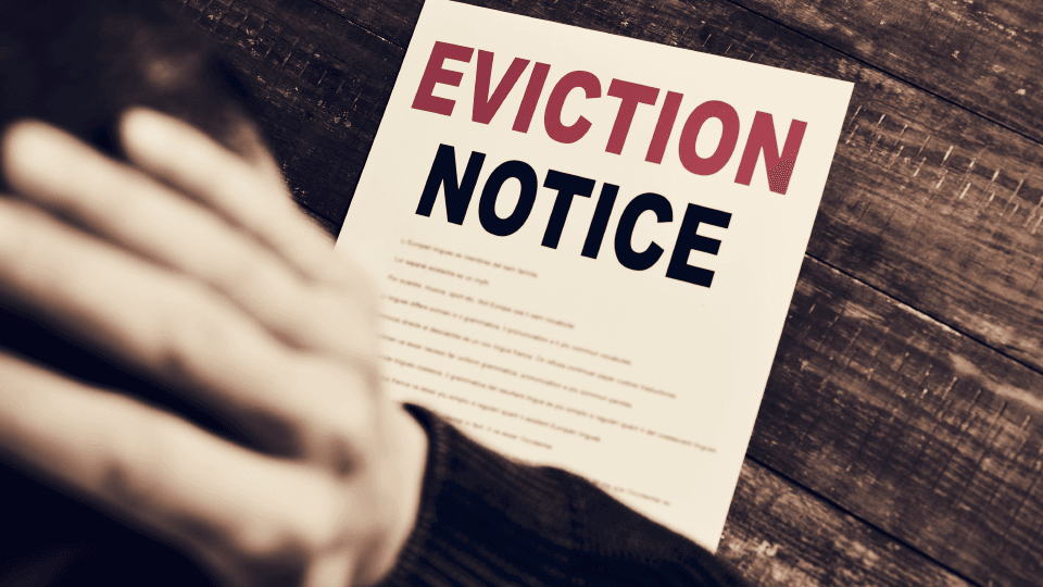 Man looking at Eviction Notice paper