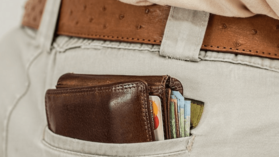 Fat wallet with cards and money in pocket