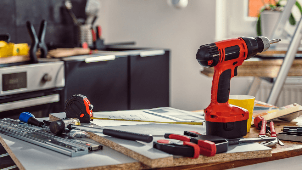Screw-drill and other tools on a table