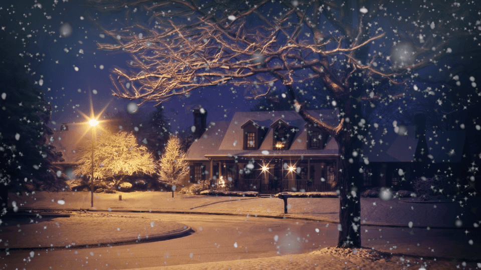 Snowing in the night, house and street light