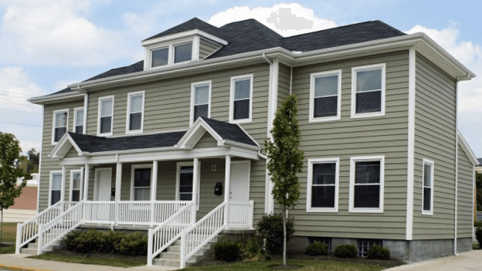 Multi-unit house with porch and two stairs