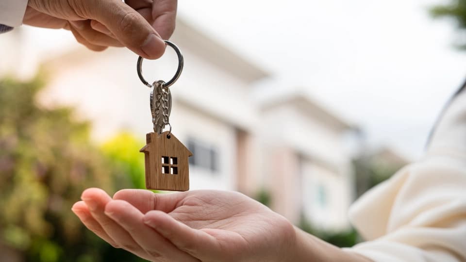 Person handing a key