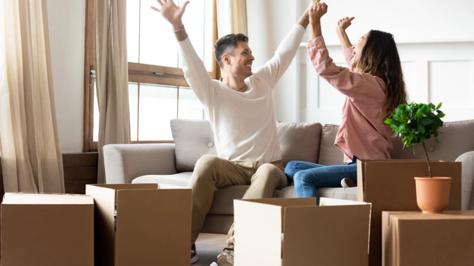 Couple celebrating in a home