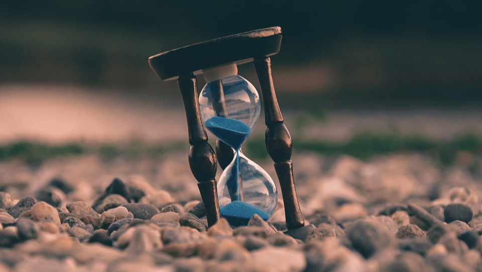 Hourglass standing on stones