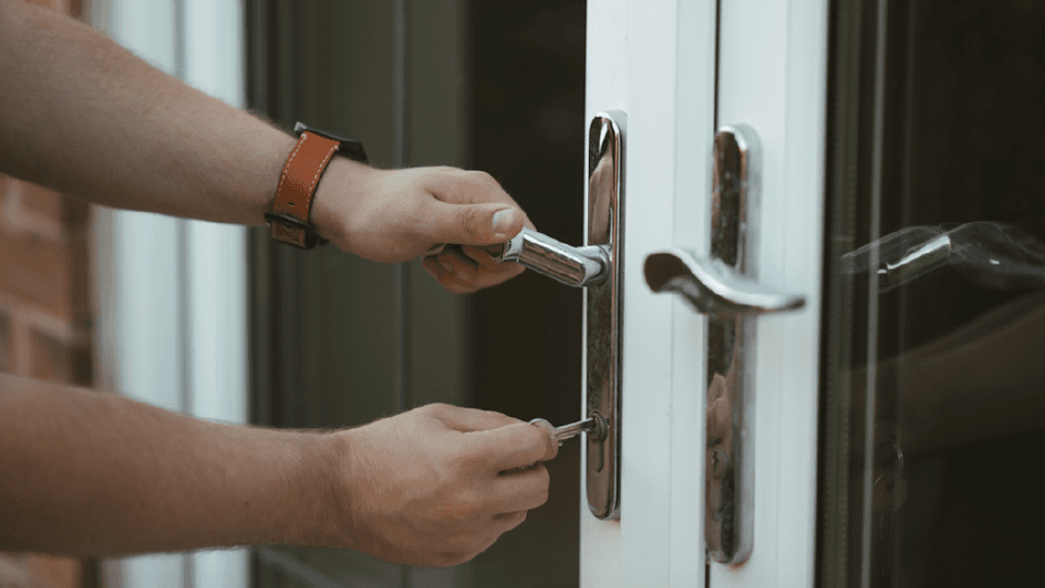Man opening the door with a key