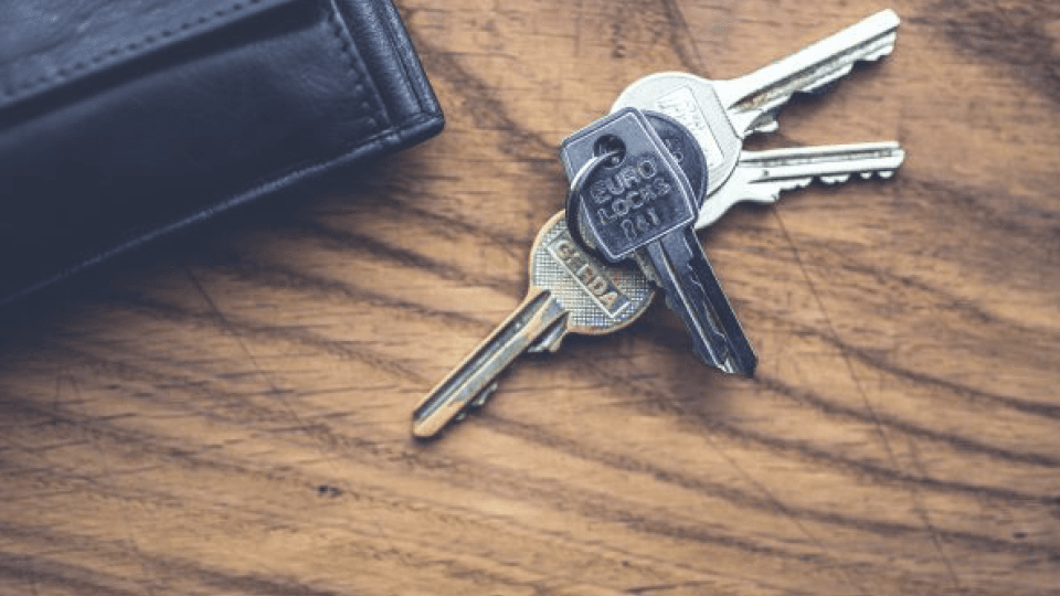 Wallet and keys laying on the table