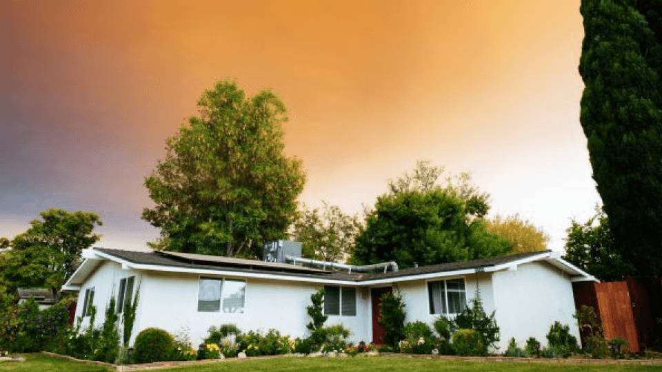 House and orange mystic skies
